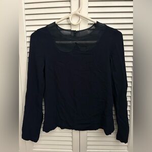 Elegant navy blue Women's Top with a sheer Peter pan neck. Sheer on the sleeves